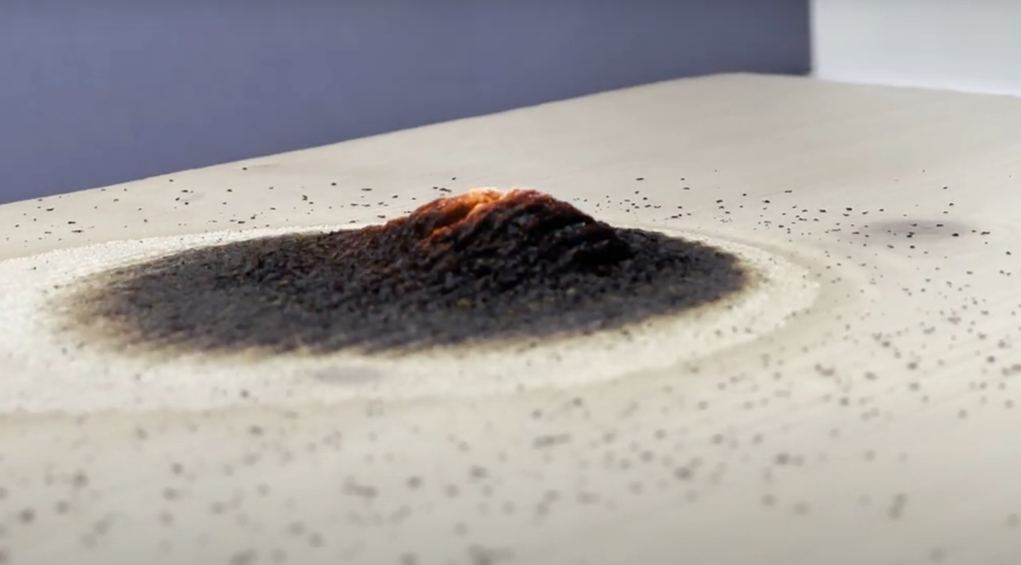 Intumescent reaction on timber treated with a flame retardant varnish